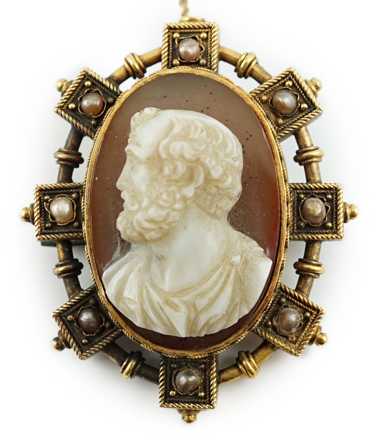 A Victorian gold and split pearl mounted oval hardstone cameo brooch, carved with the bust of a gentleman to dexter